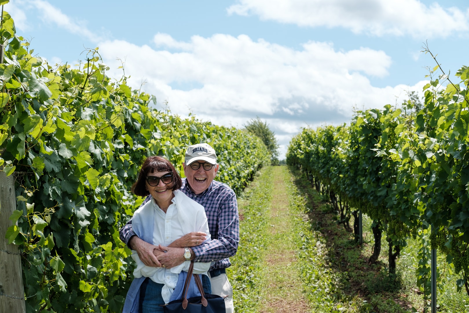 Older Couple Smiling in a Winery
