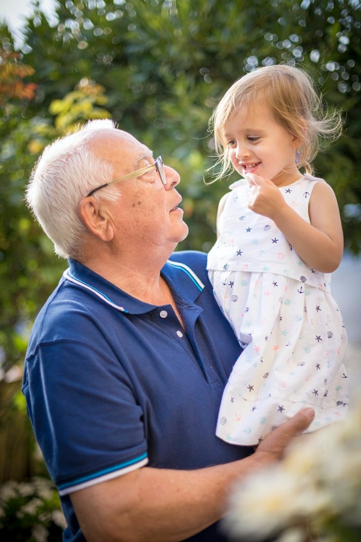 Grandpa holding Grandchild